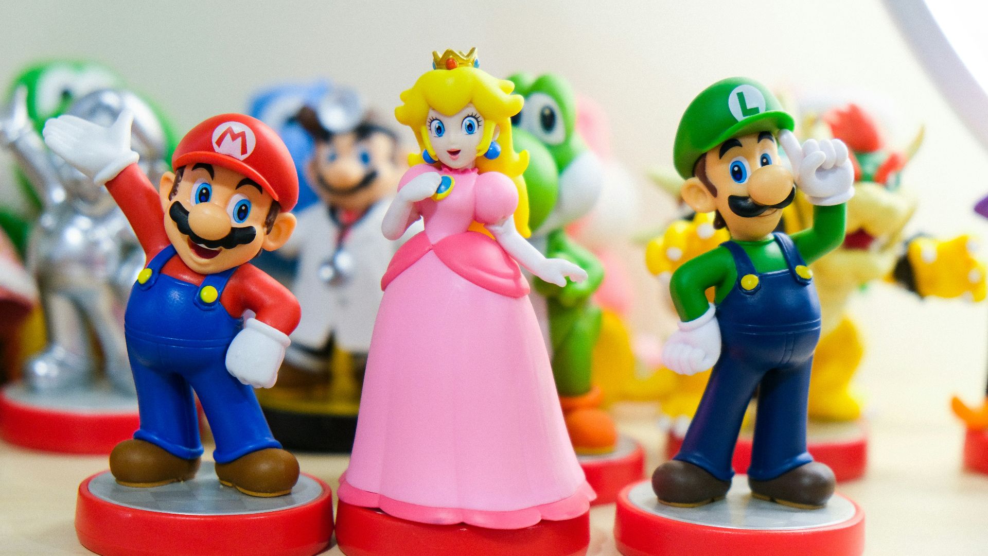 Super Mario, Luigi, and Princess Peach figurines
