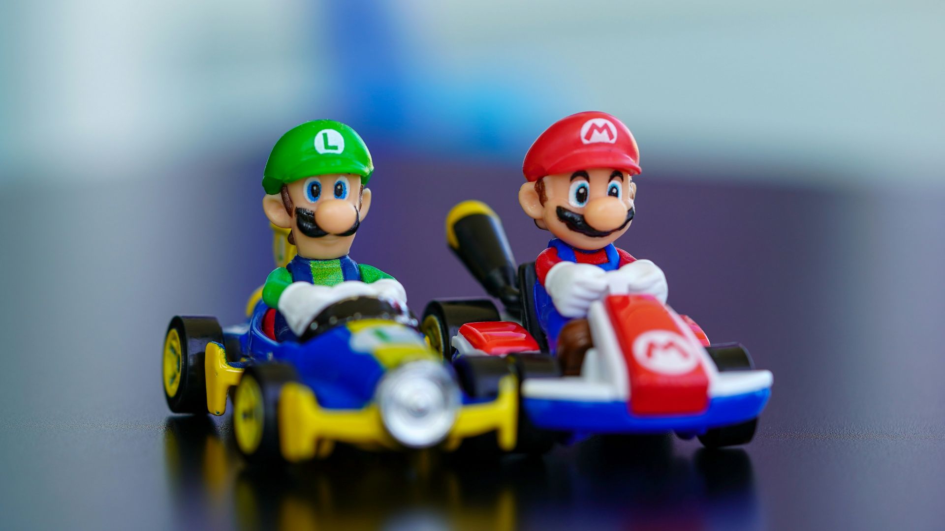 lego mini figure riding blue and red toy car