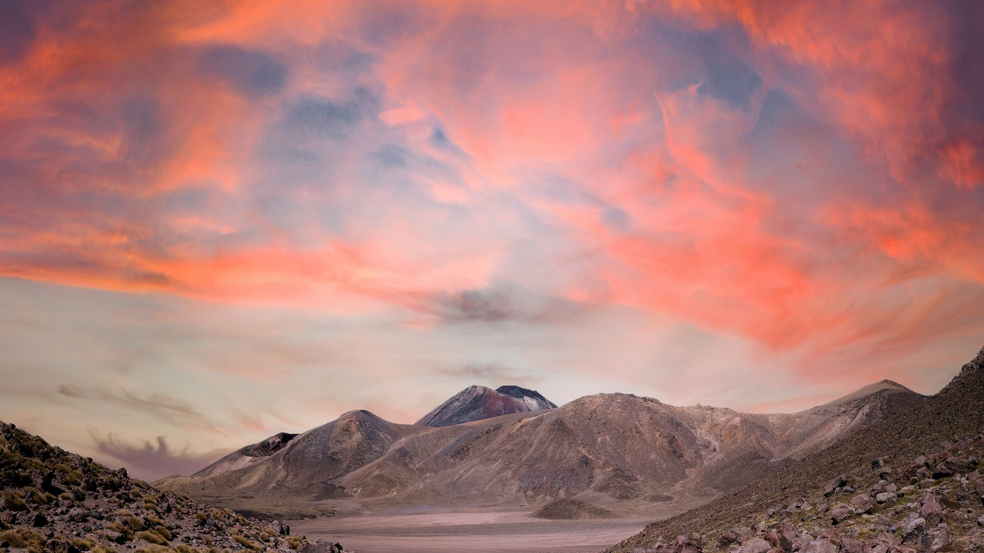 snow covered mountain under orange and blue sky