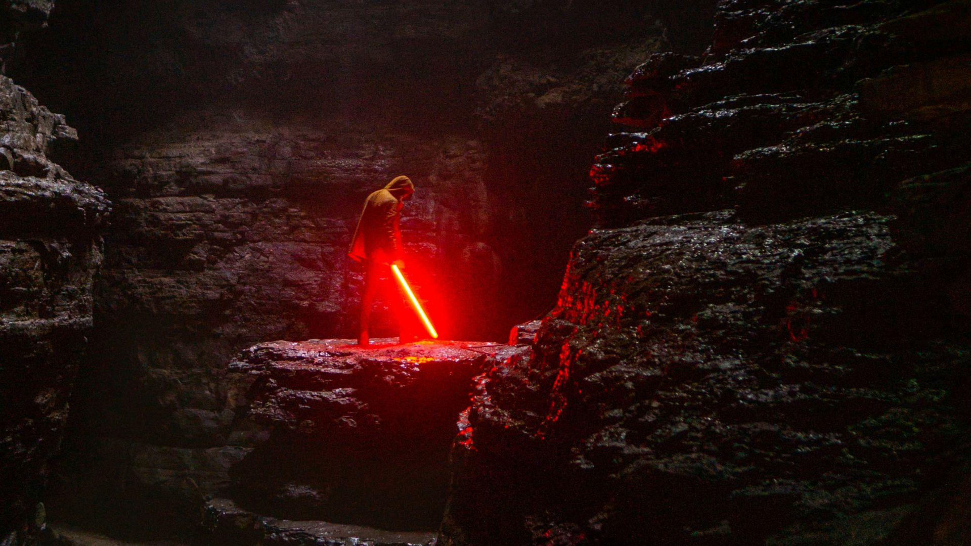 person holding red lightsaber