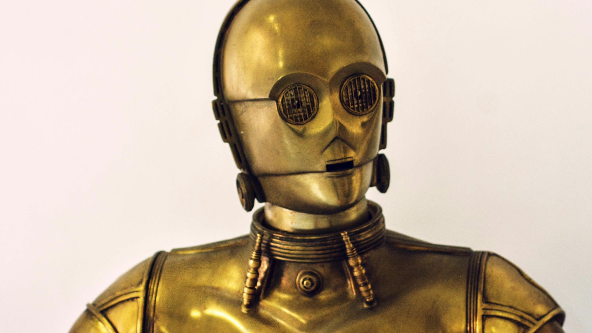 person wearing gold mask and mask