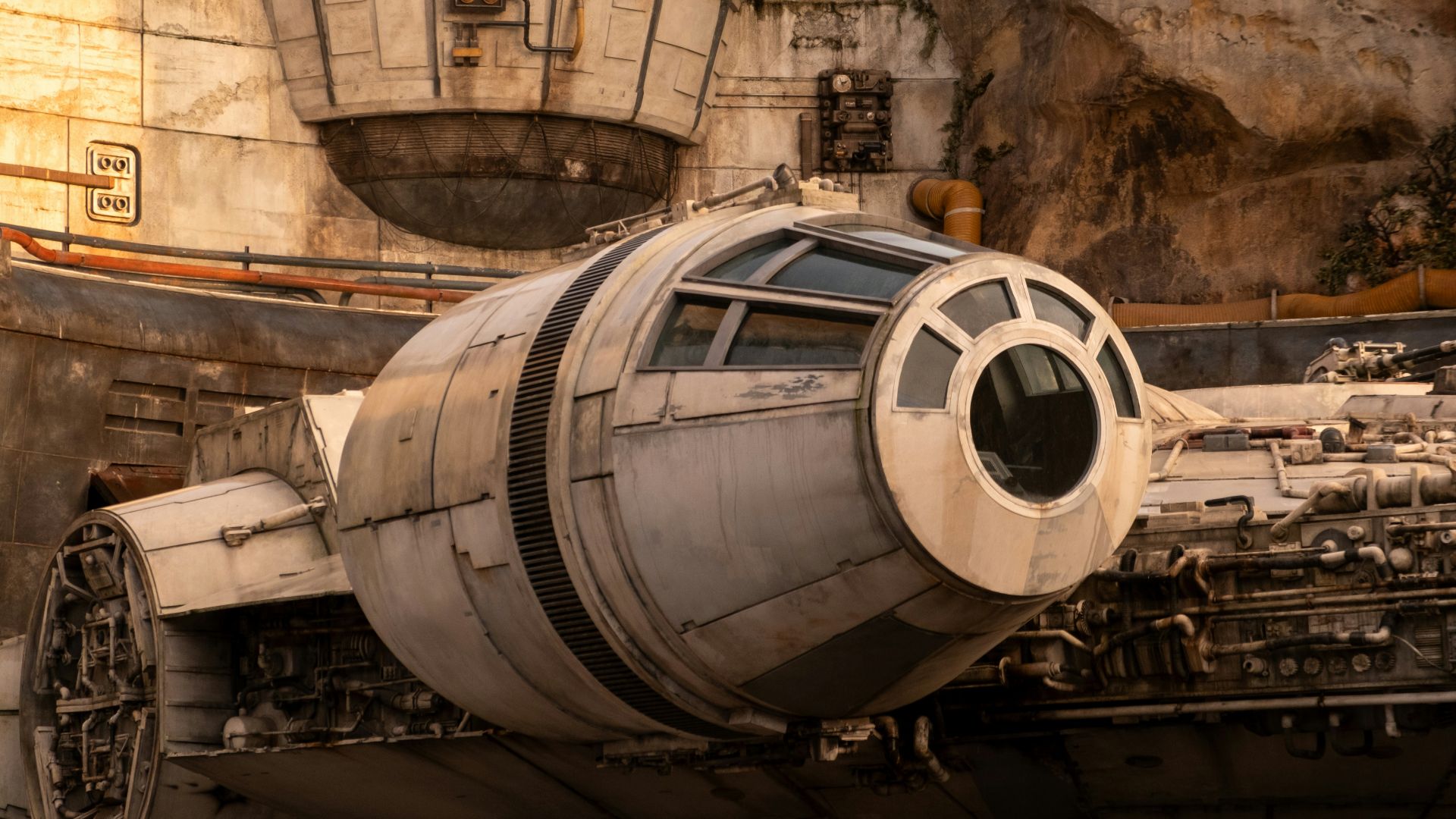 a star wars vehicle is parked in front of a mountain