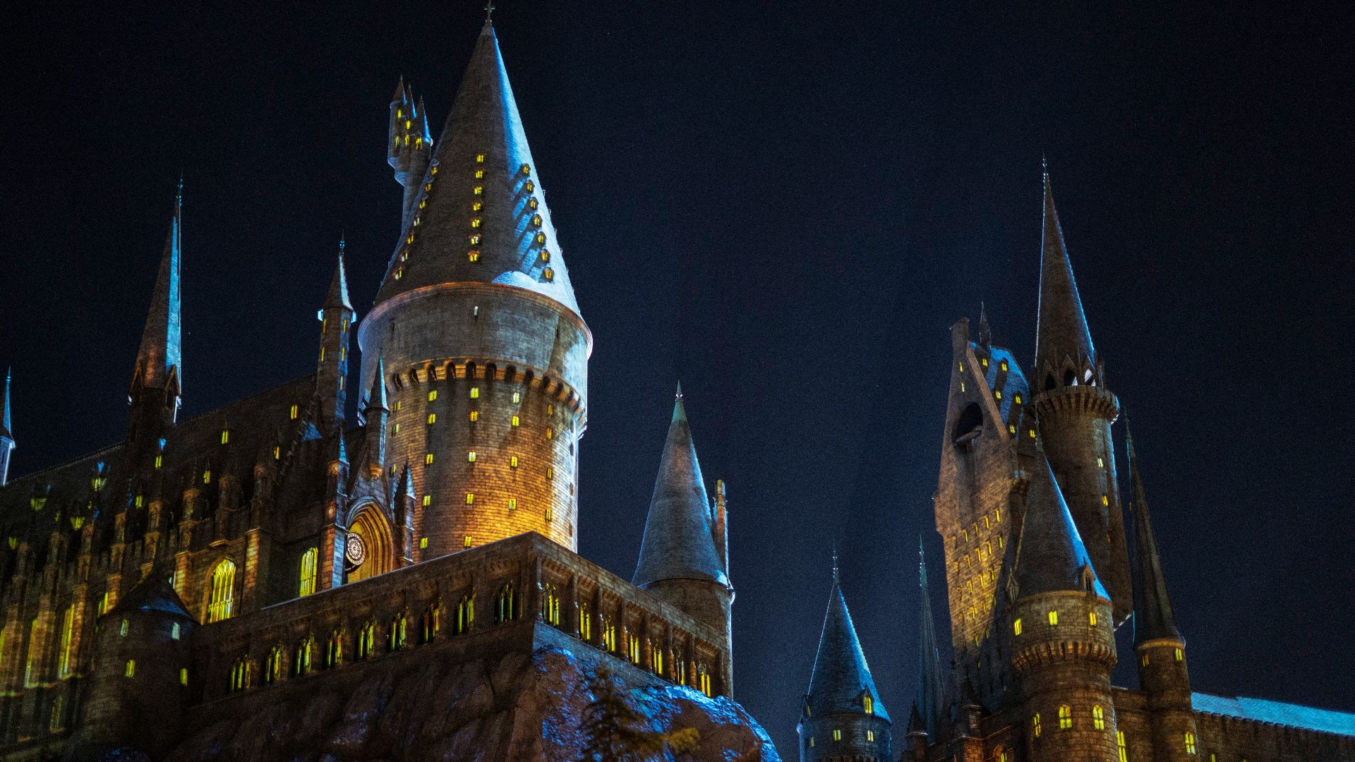 a castle lit up at night