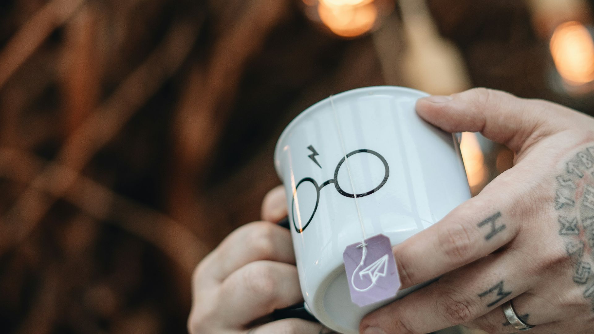 person holding white ceramic mug