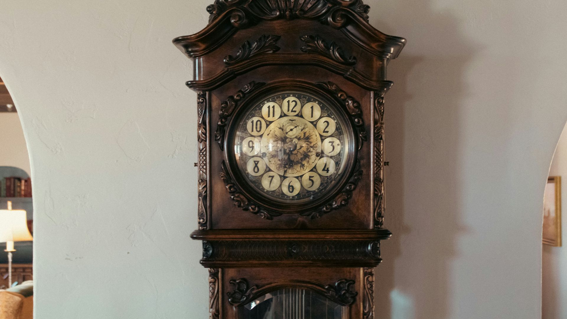 A grandfather clock sitting on top of a table