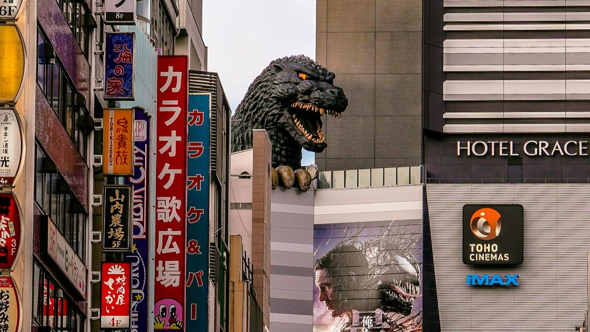 A city street filled with lots of tall buildings