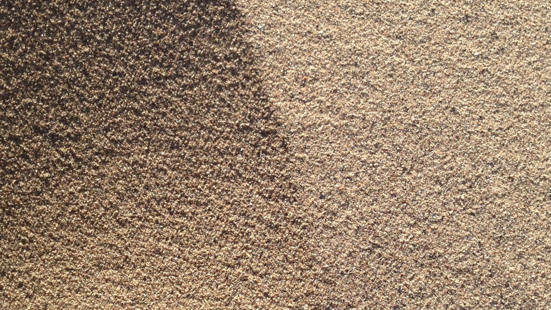 brown sand with shadow of person