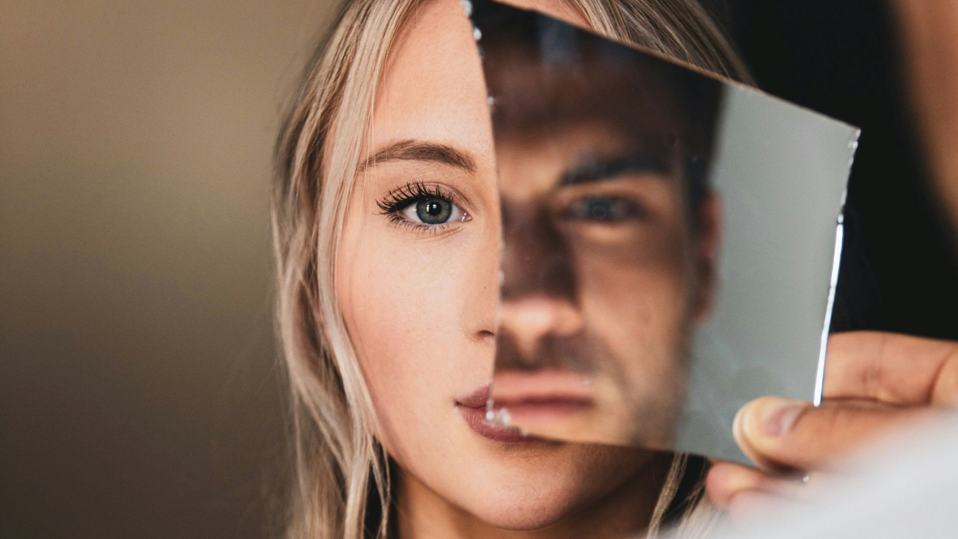woman in black tank top holding white textile