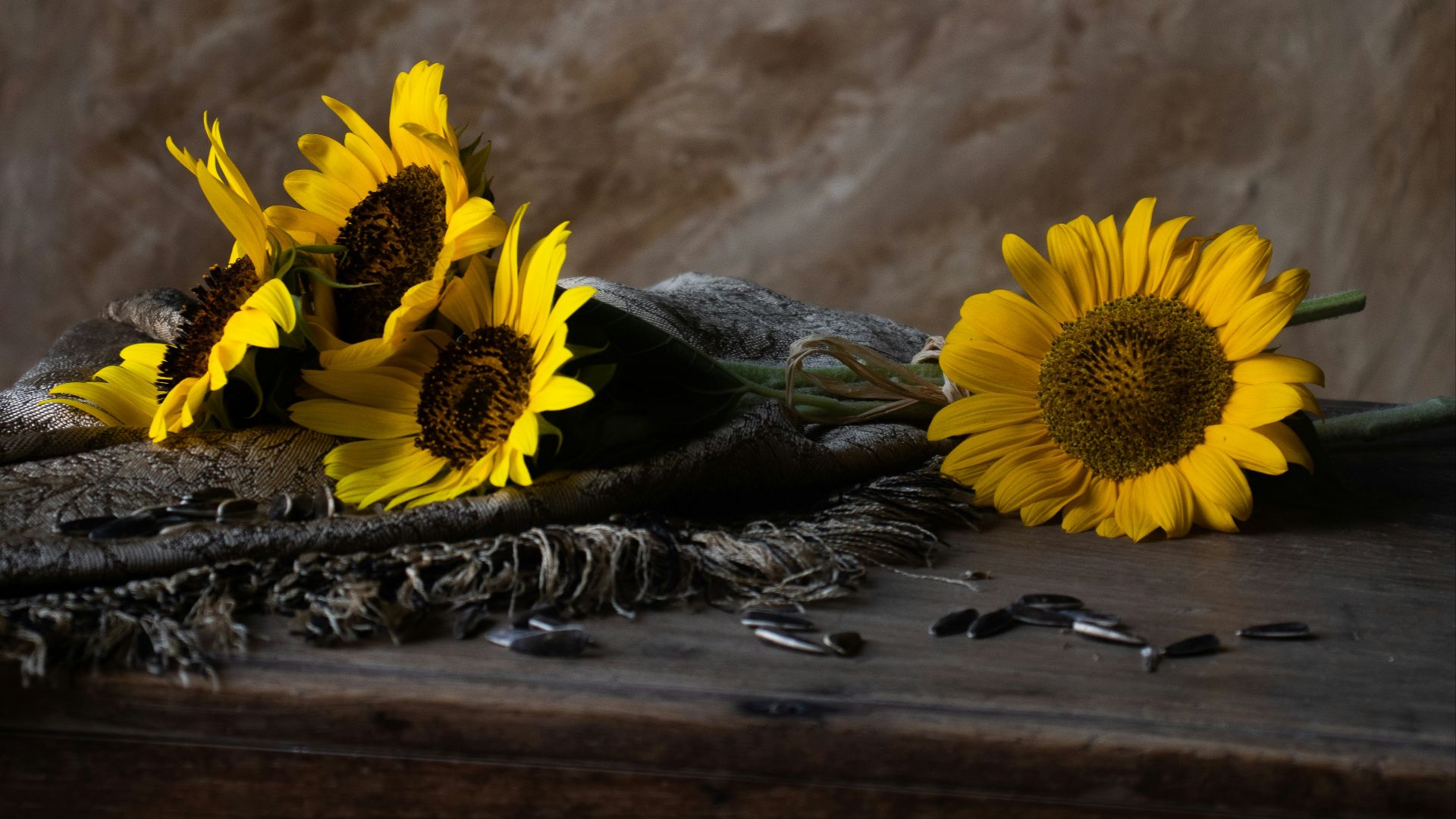 a bunch of sunflowers sitting on top of a table