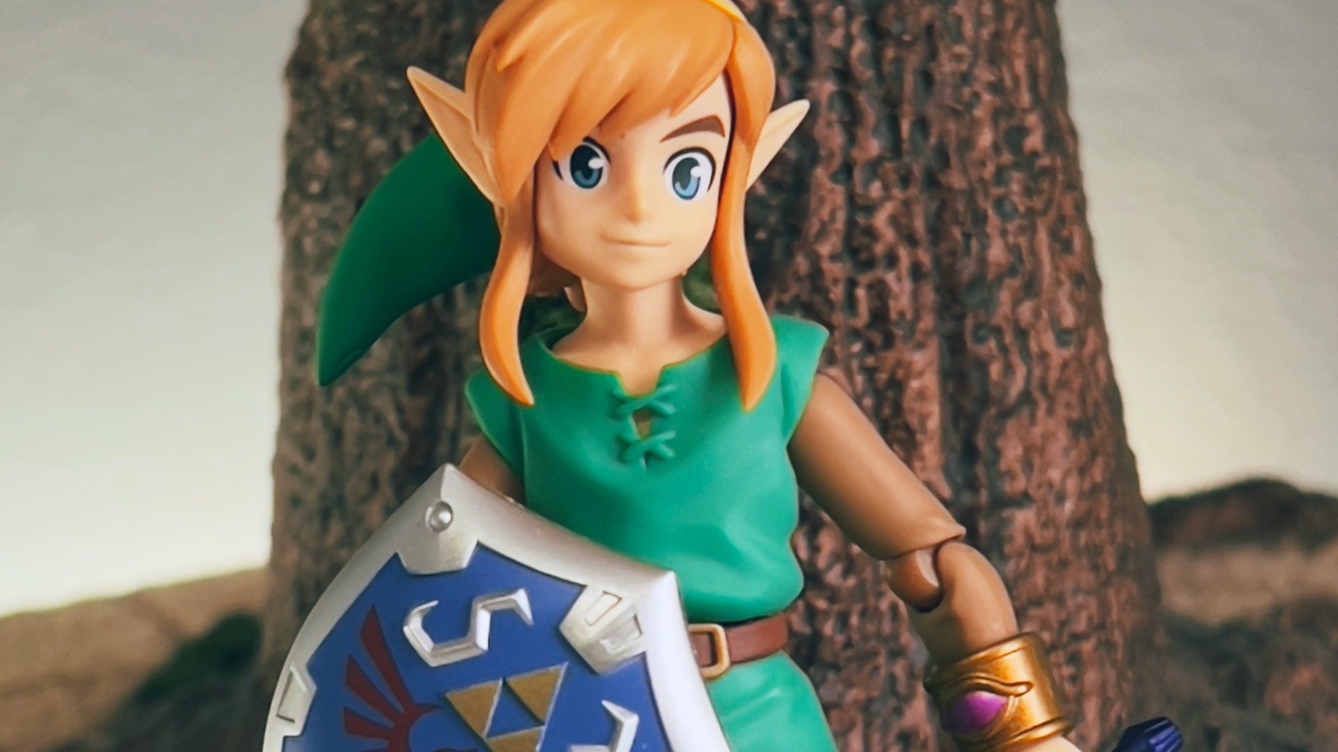 a toy girl holding a sign