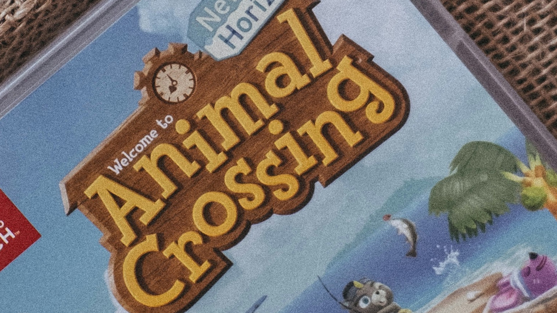 a nintendo wii game sitting on top of a blanket