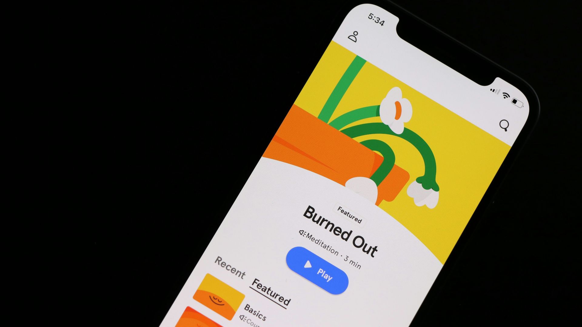 a cell phone with a picture of a plant on the screen