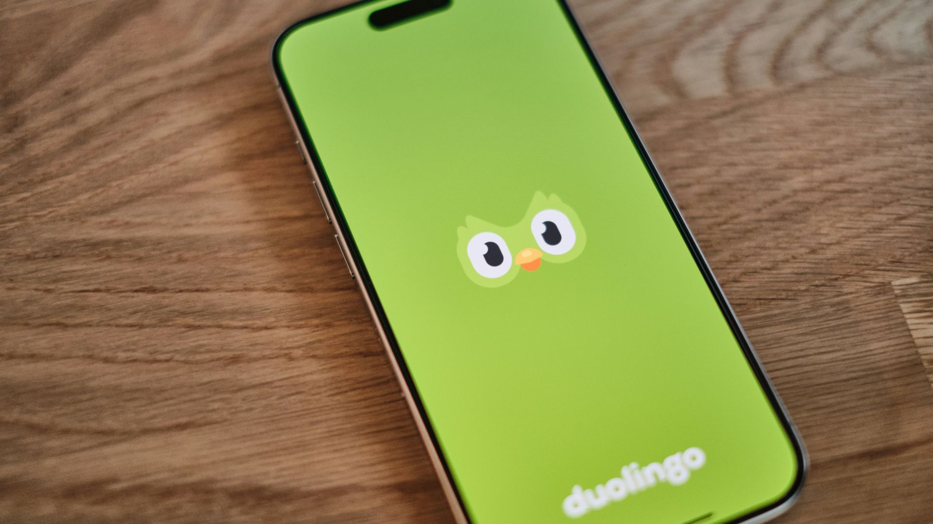 A green phone with a face drawn on it