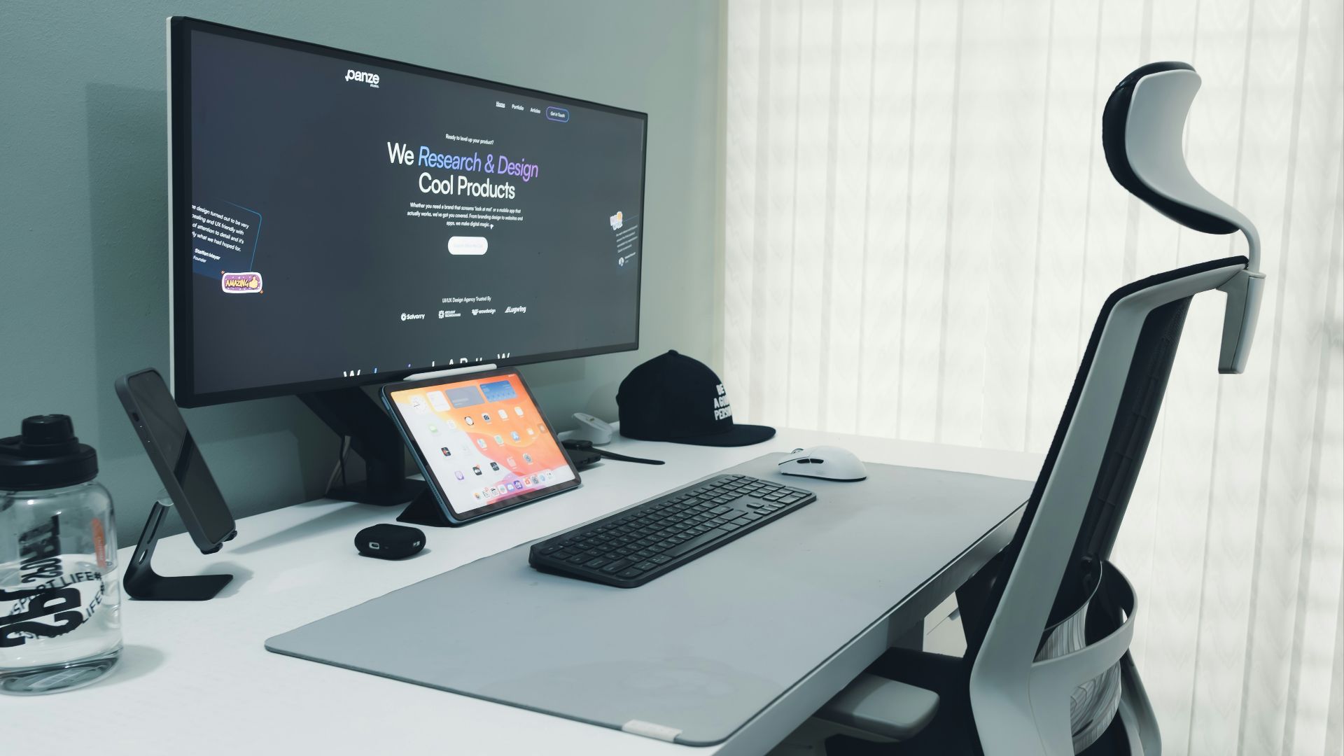 Modern desk setup with computer and ergonomic chair