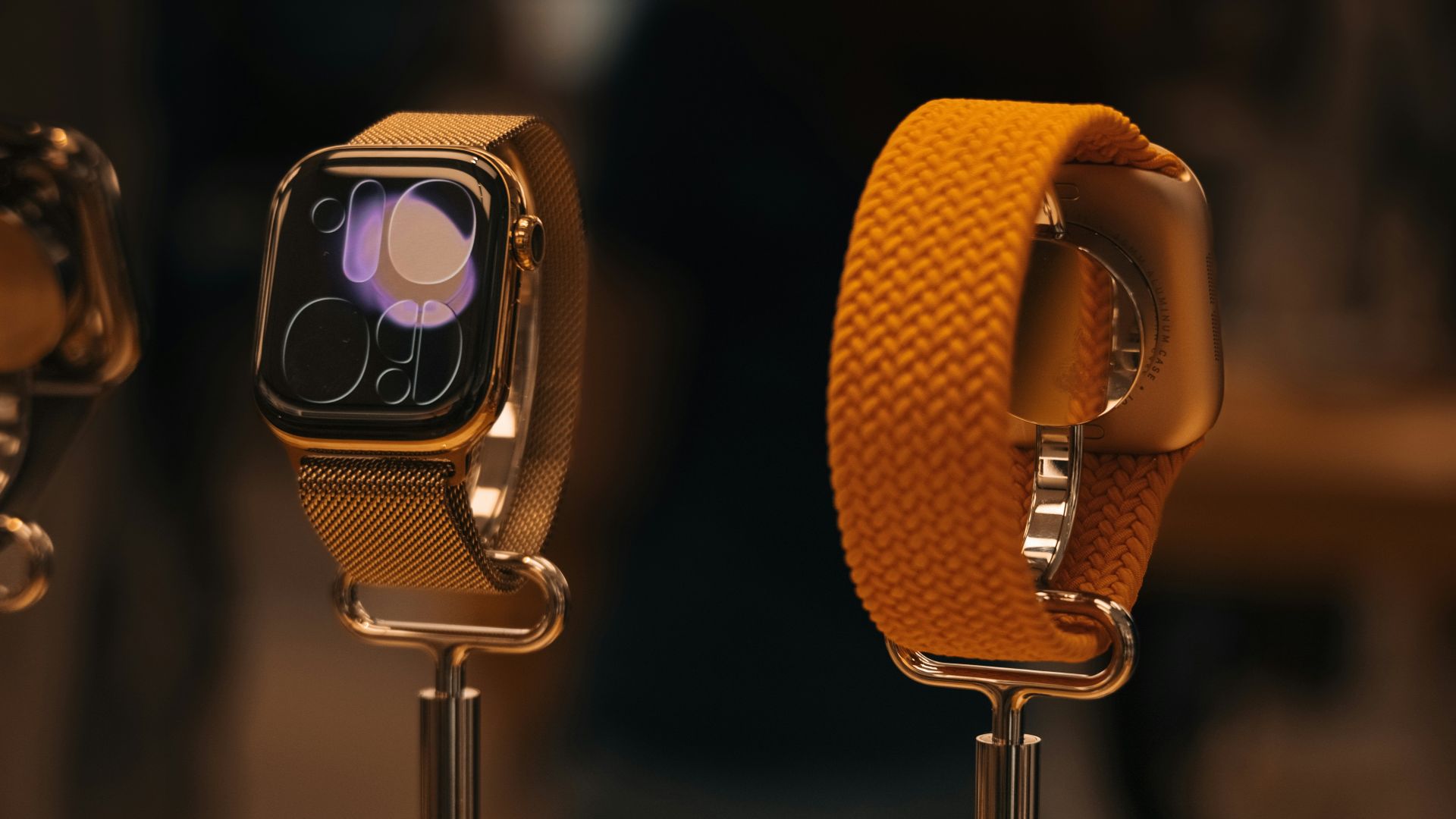 Two smartwatches displayed with different bands