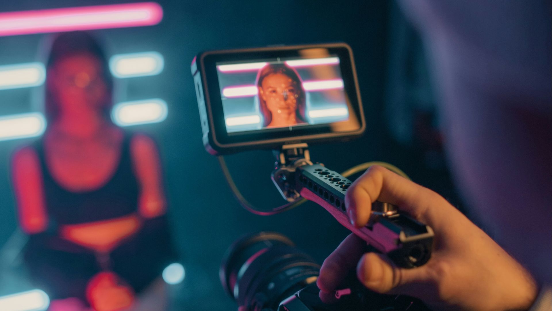 person holding black smartphone taking photo of man in black shirt