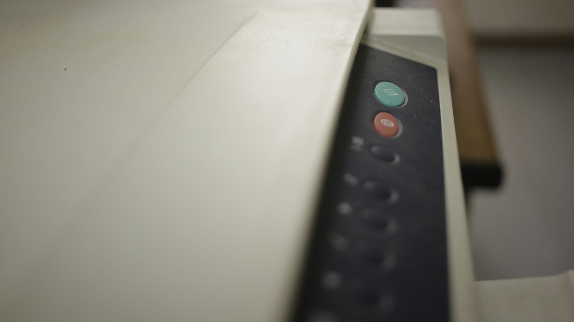 black remote control on white printer paper