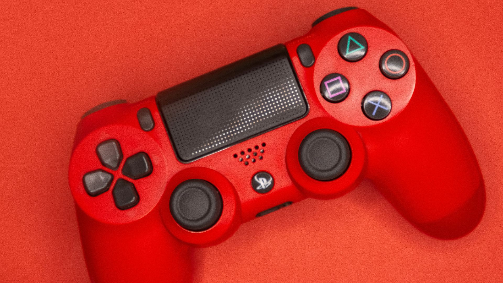 red and black sony ps 4 controller