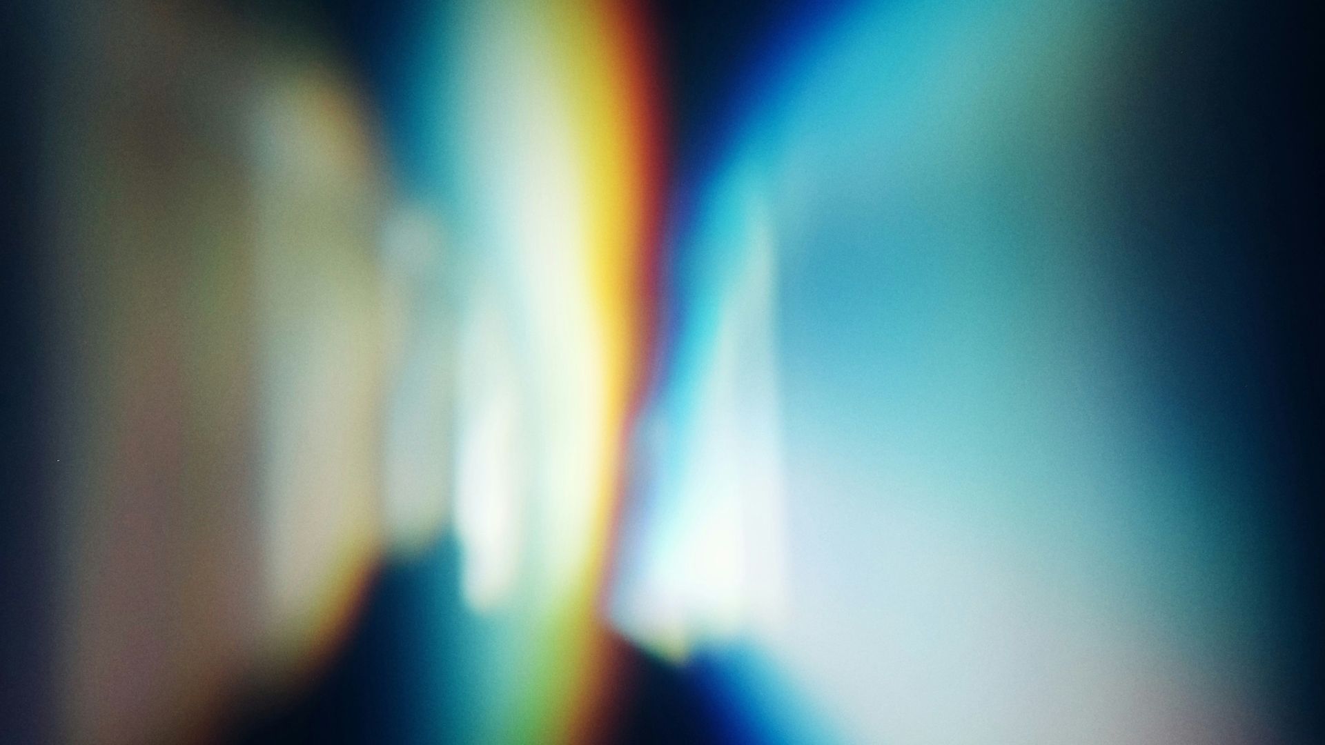 a blurry image of a rainbow