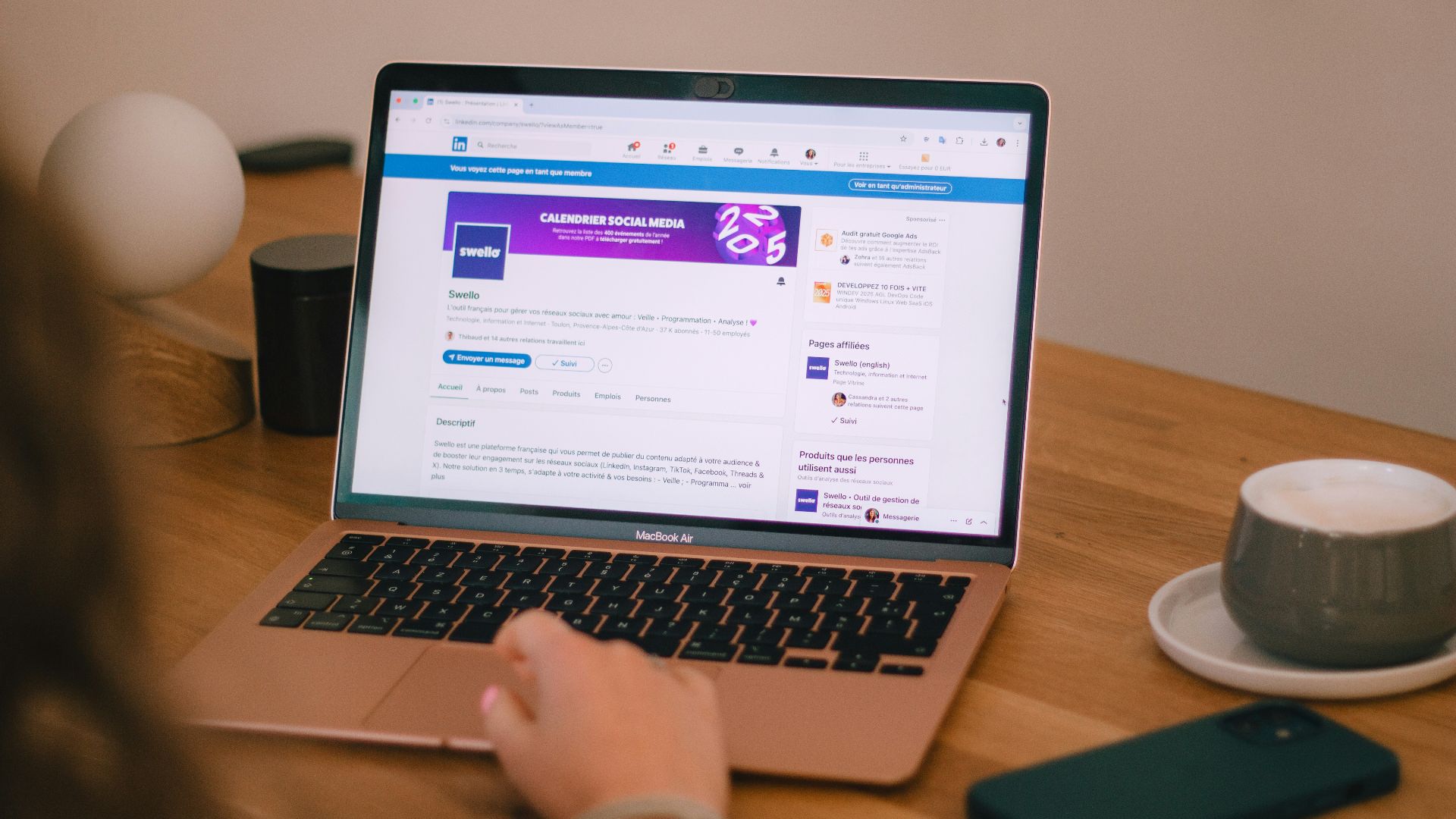 Someone is using a laptop, likely browsing social media.