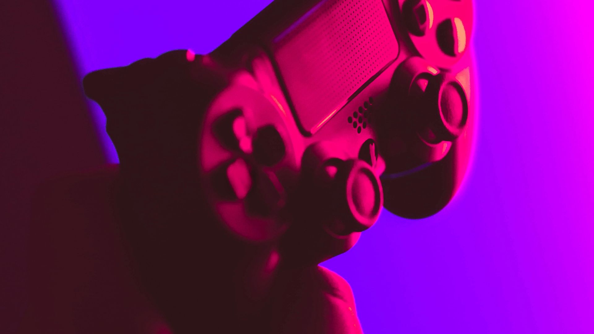 person holding black and gray game controller