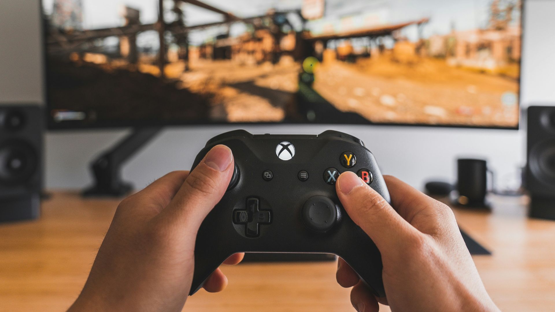 person holding black game controller