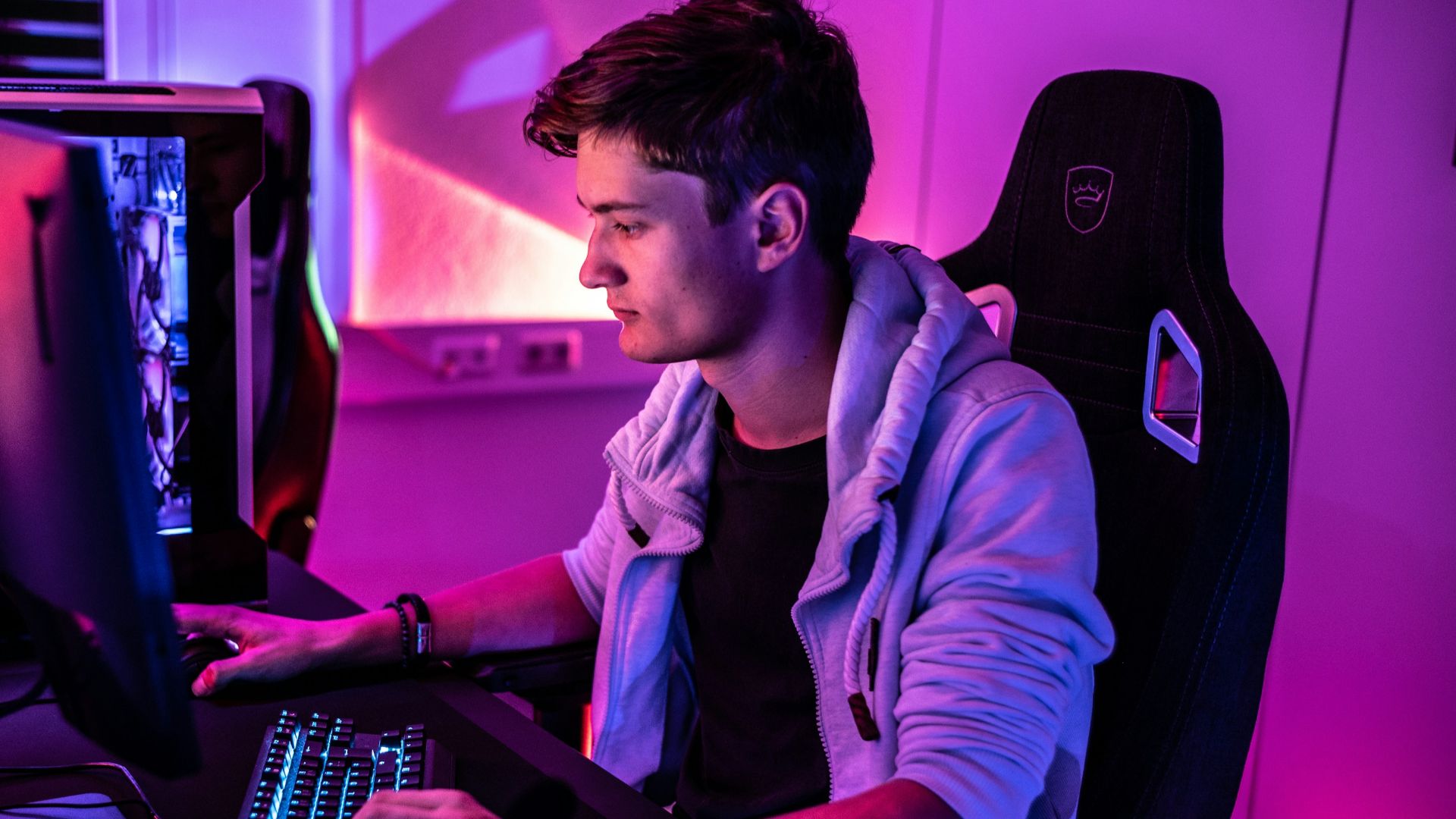 a man sitting in front of a computer keyboard