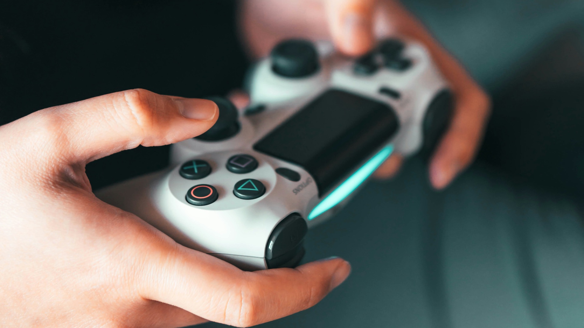 person holding gray game controller