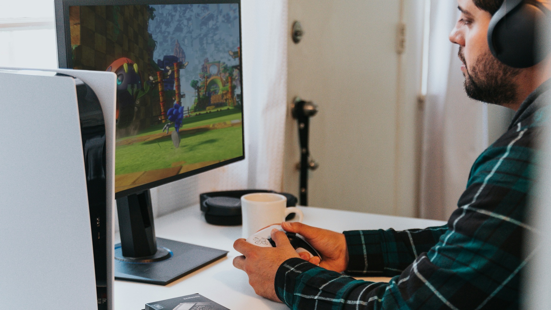 a person wearing a mask and sitting at a desk