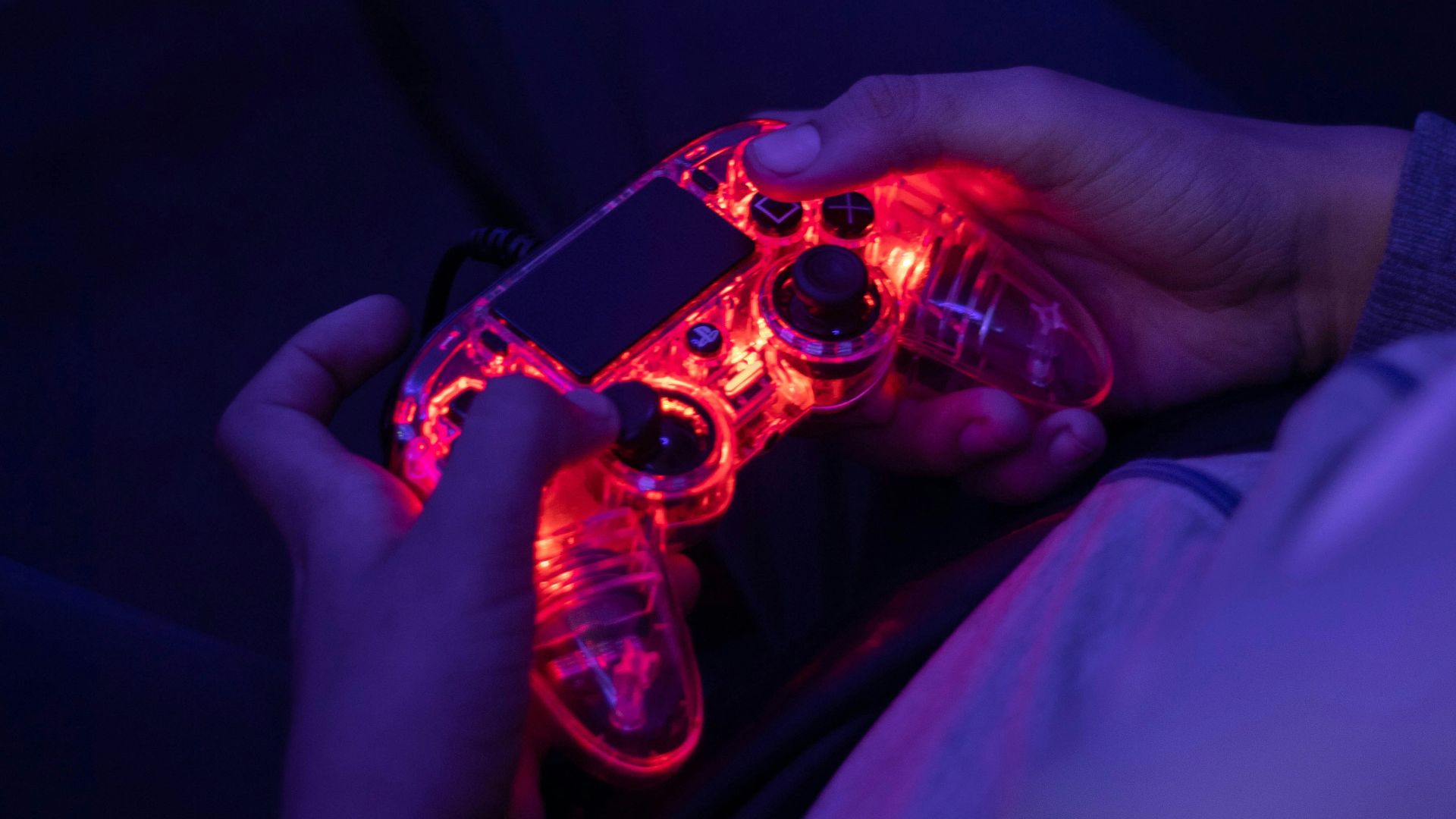 a person is holding a video game controller