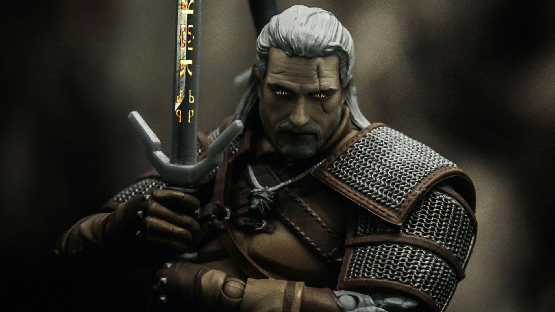 man in black and brown suit holding sword