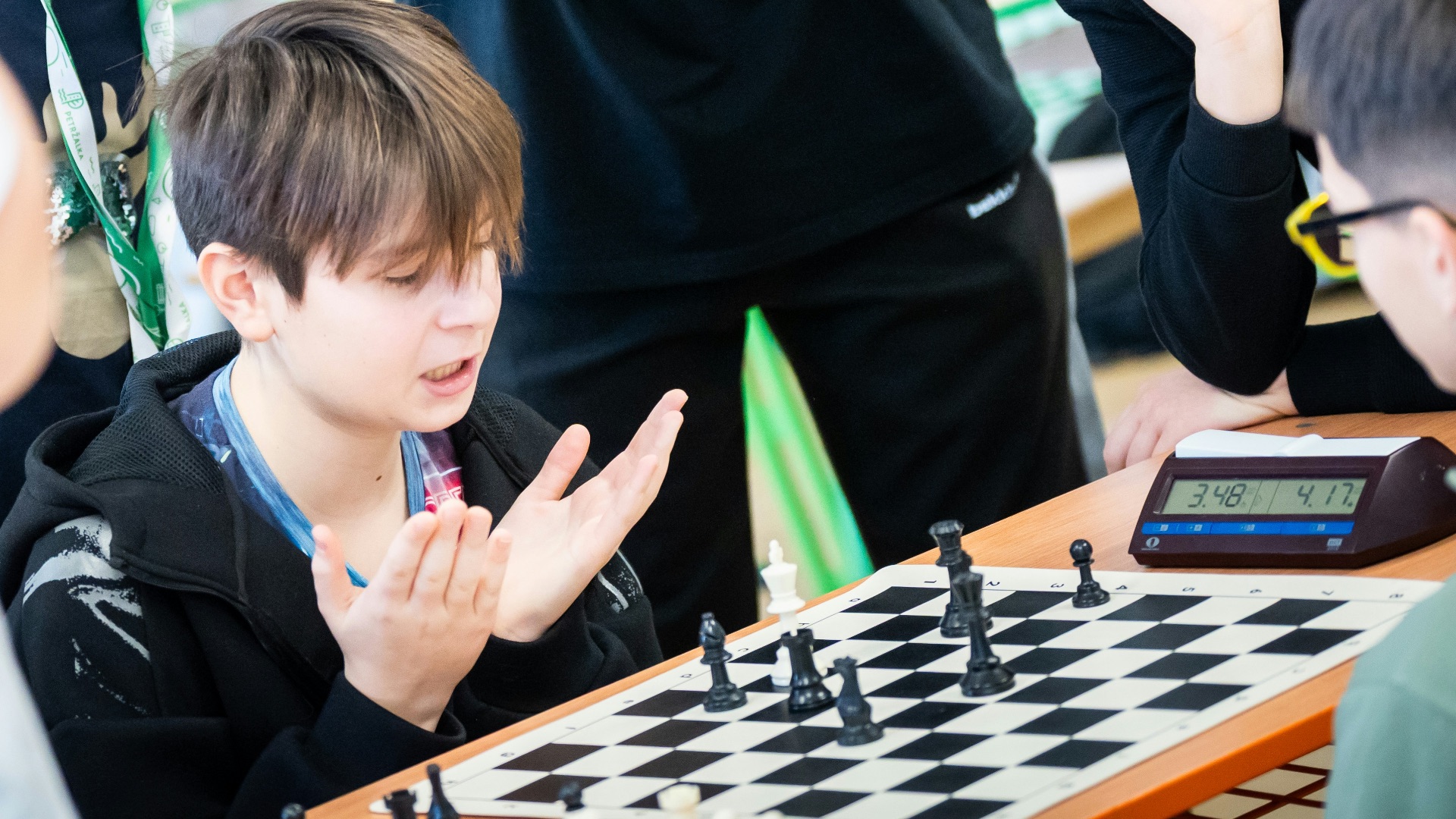 A group of young men playing a game of chess