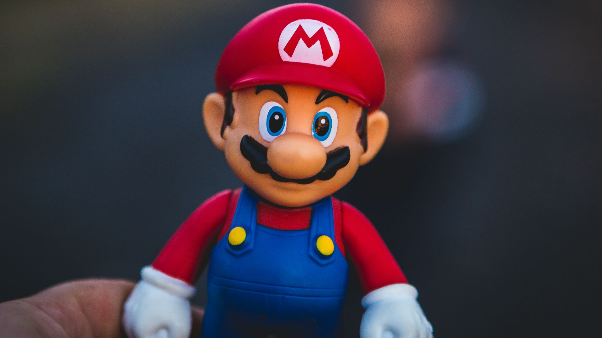 super mario in blue and red shirt figurine