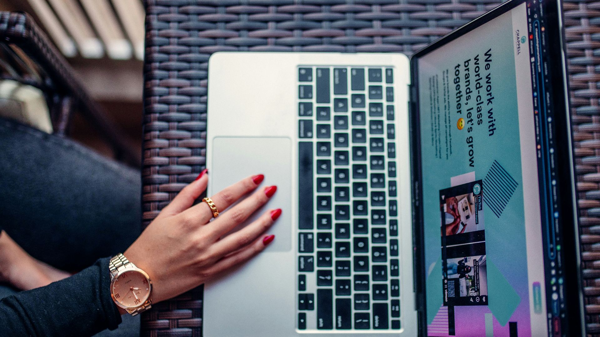 a woman using a laptop computer on a table
