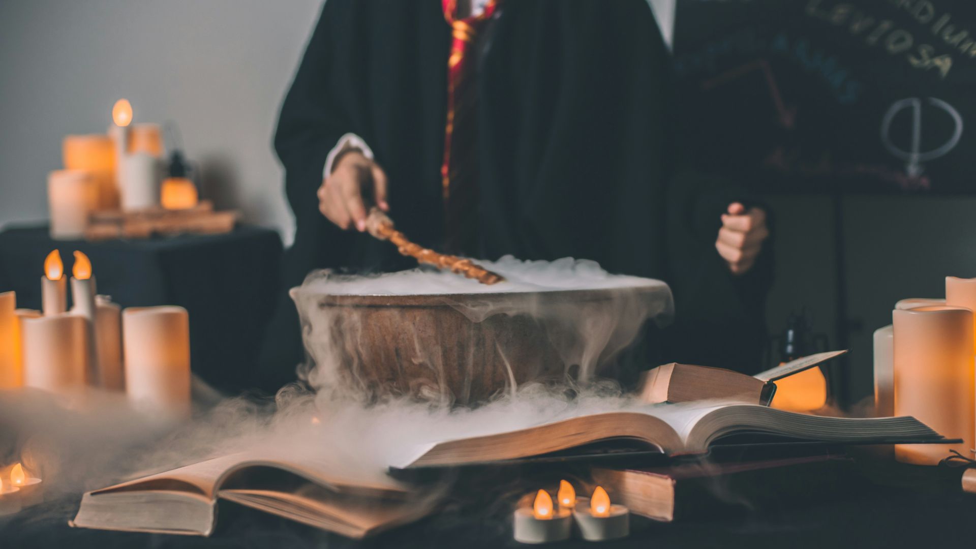 person holding wand on top of bowl