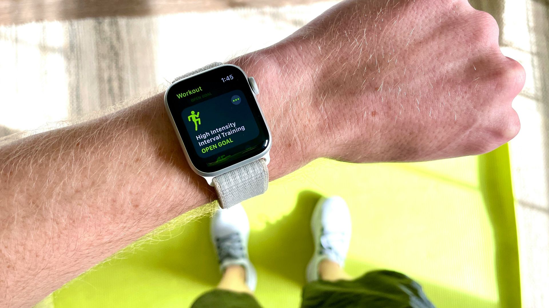 silver aluminum case apple watch with white sport band