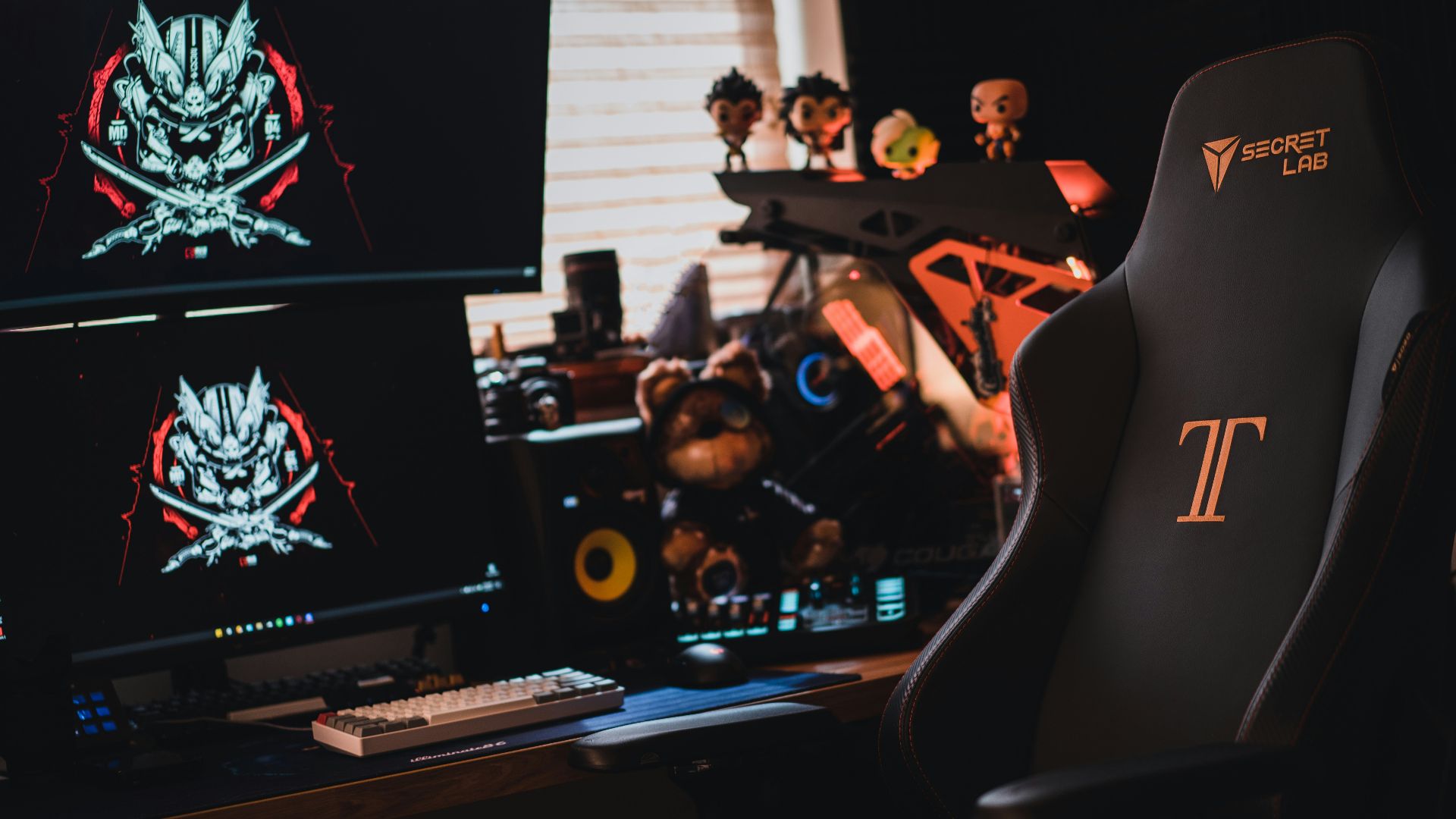 black flat screen tv turned on near black audio component