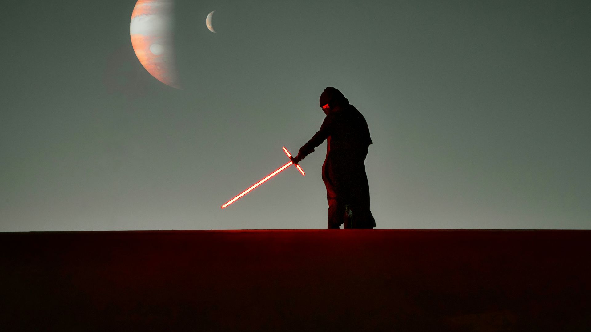 a man that is standing in the dark