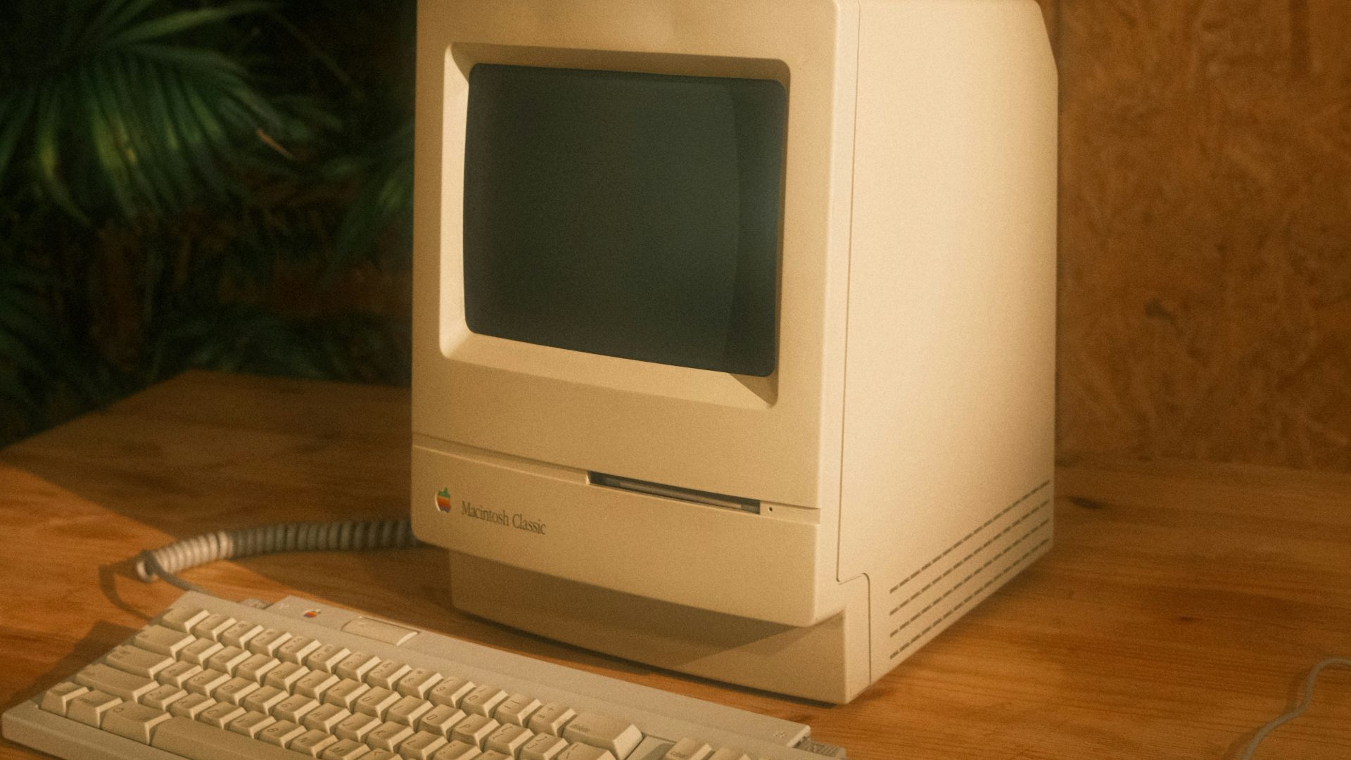 a desktop computer sitting on top of a wooden desk