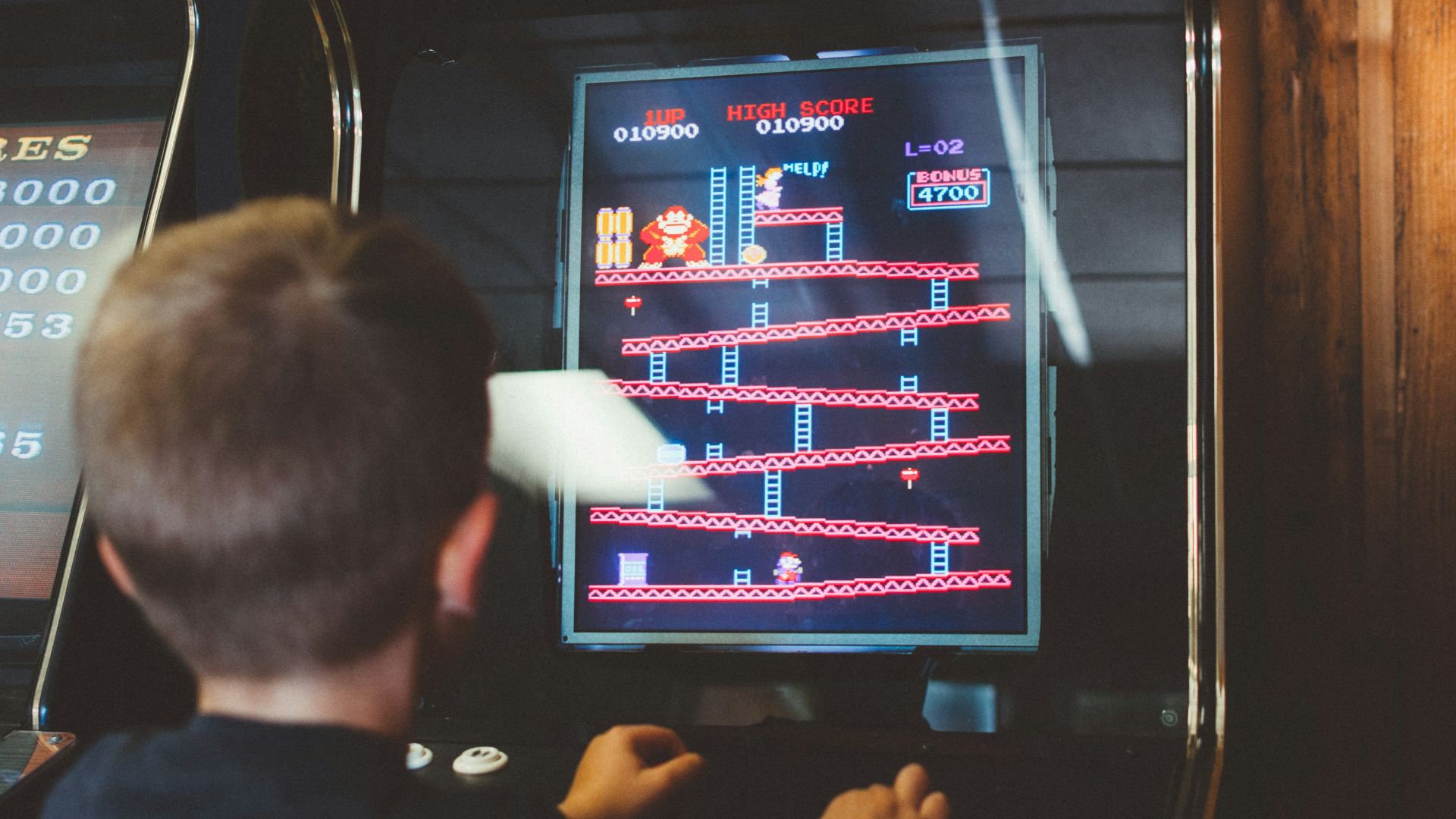 boy playing donkey kong arcade box
