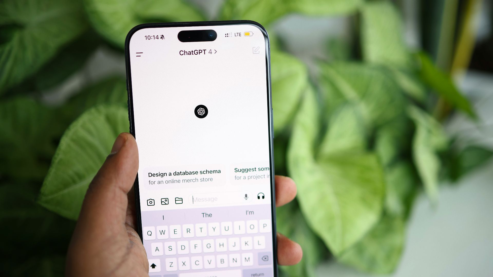 a person holding a cell phone in their hand