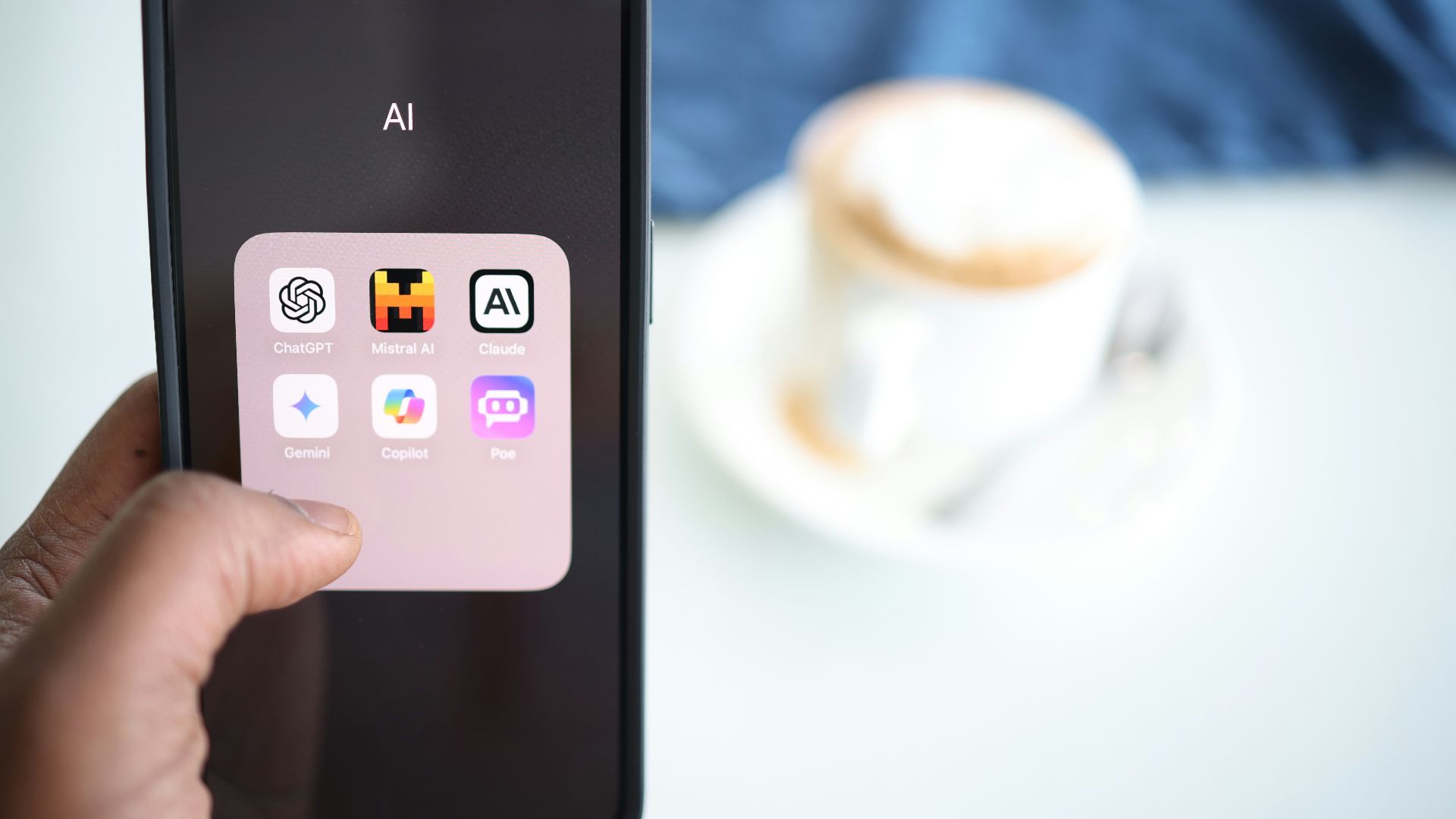 a person holding a cell phone in their hand