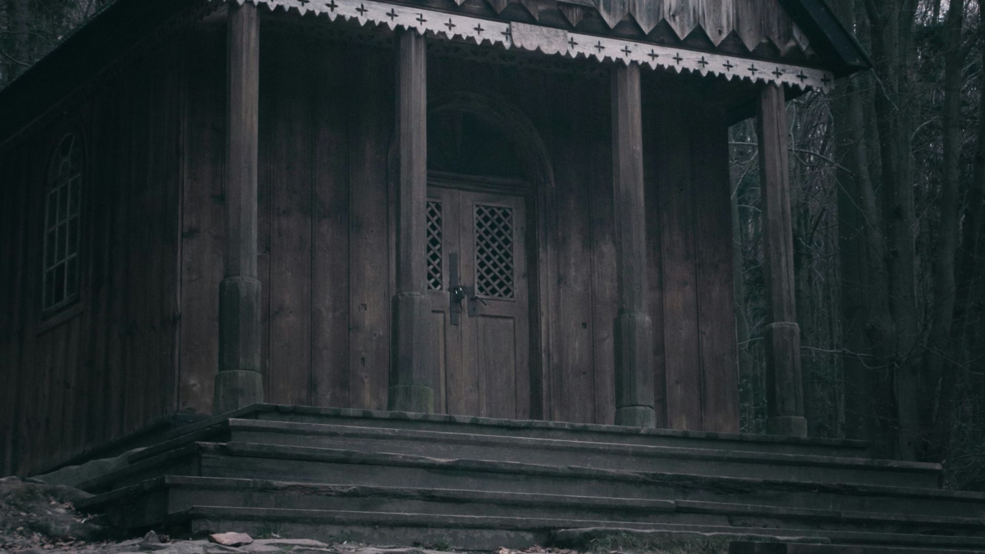 a wooden building with a steeple