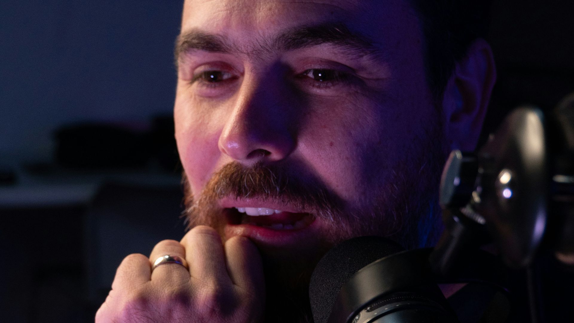 A man sitting in front of a computer keyboard