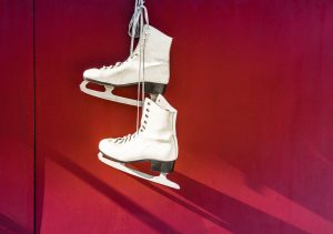 hanged-pair-of-white-leather-figure-skates-914996-300x211.jpg