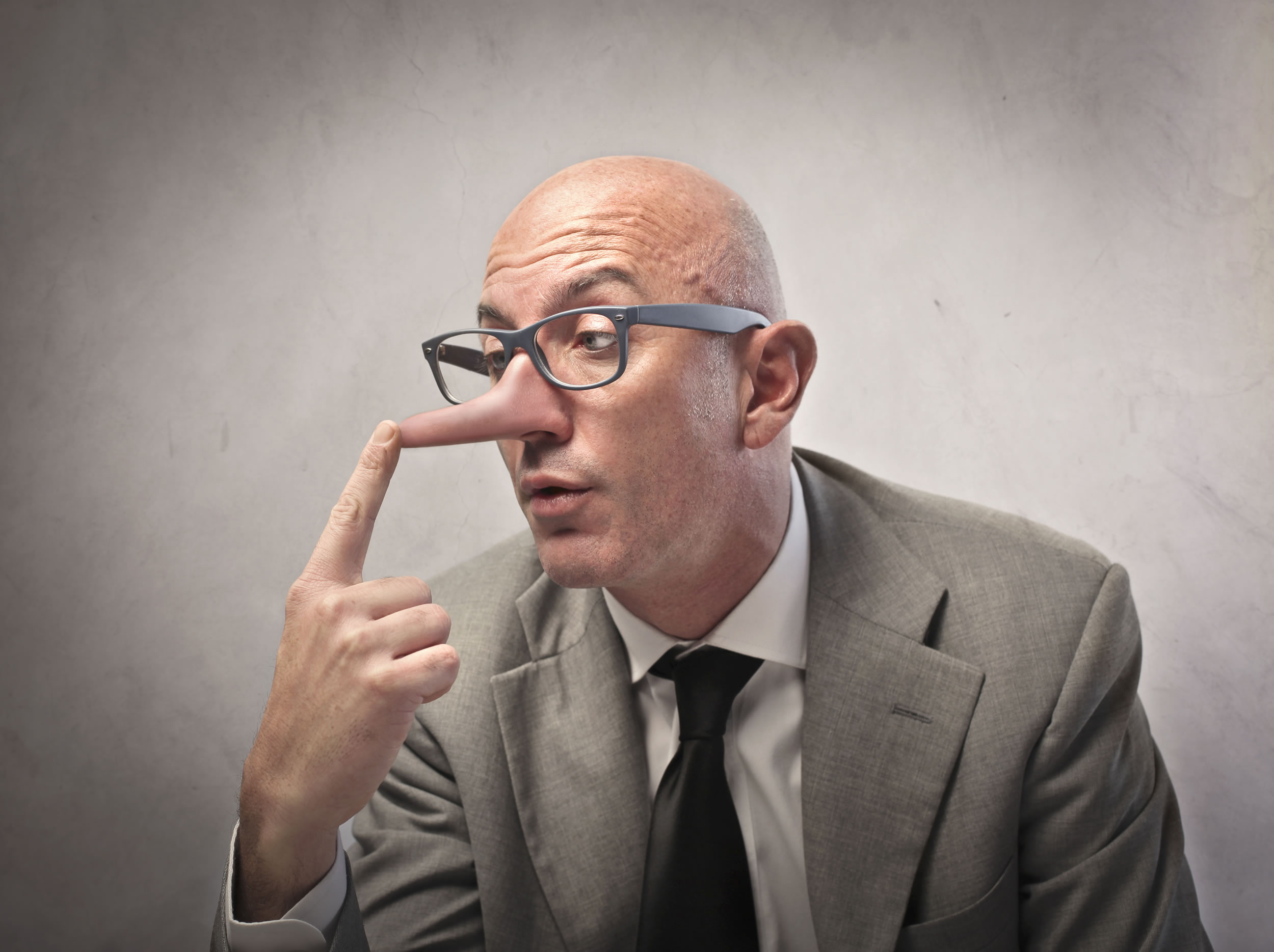 bigstock-Lying-businessman-observing-hi-25876415.jpg