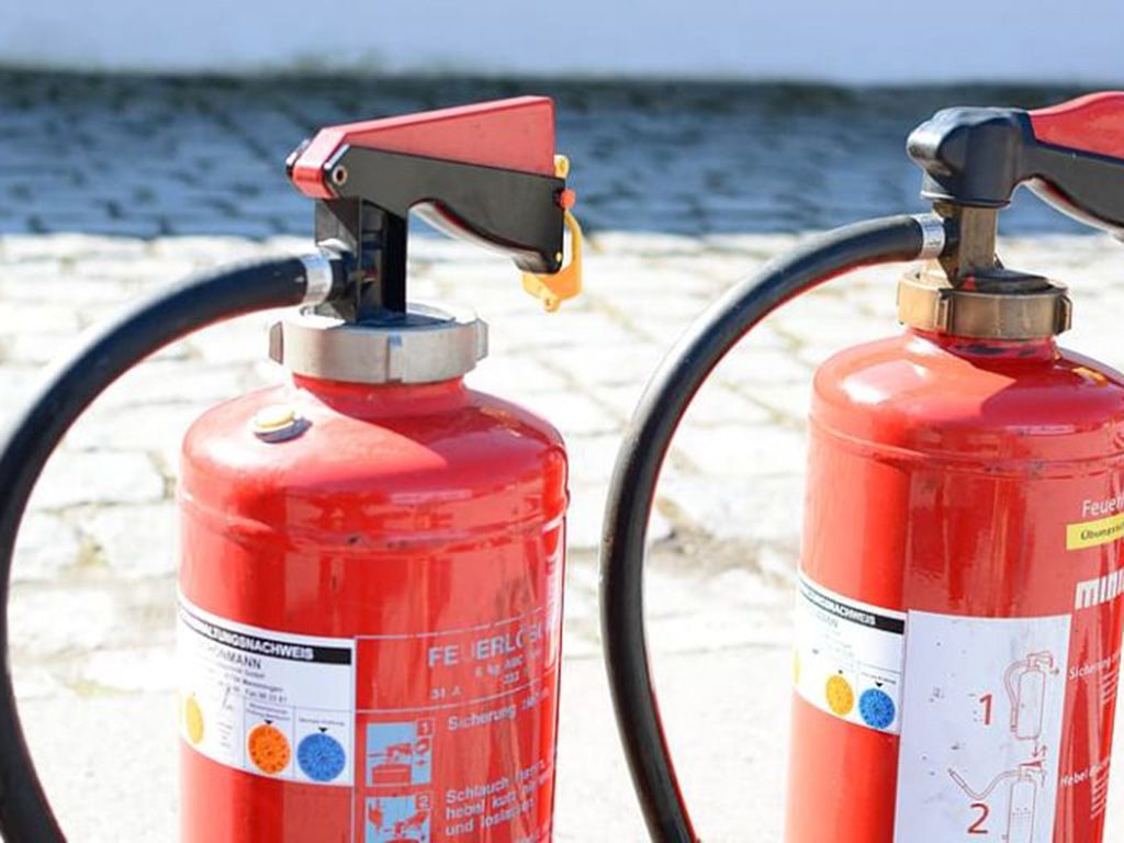 resizetwo-red-fire-extinguishers-on-gray-pavement-768x512-1.jpg.optimal.jpg