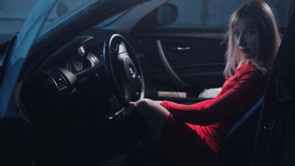 girl_in_car_in_a_red_dress_behind_the_wheel_blonde_makeup_woman_model_photo-1551767698520-1024x576.jpg.optimal.jpg