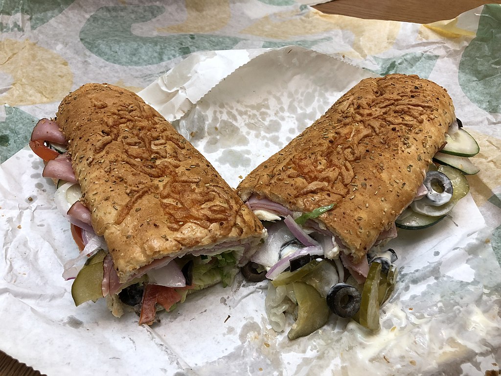 2019-10-19 19 31 55 A Black Forest Ham Foot-Long Sandwich From Subway With American Cheese, Black Olives, Cucumbers, Lettuce, Pickles, Tomatoes, Red Onions, Regular Mayonnaise, Oil, Red Wine Vinegar