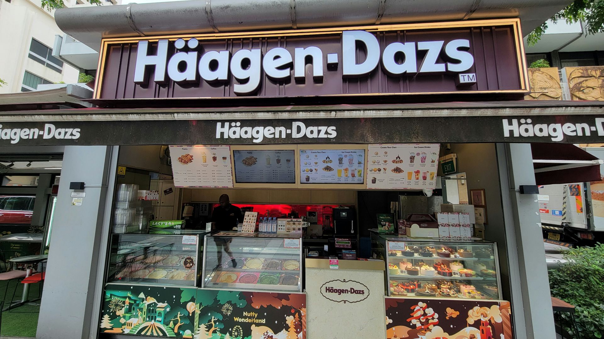 The front of a restaurant with a large sign above it